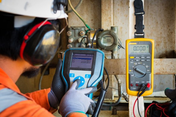 Man working under electrical equipment